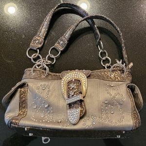 Concealed Carry purse. Silver leather with rhinestone and rivet accents.